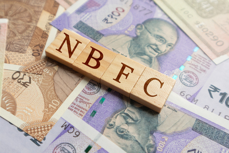NBFC in wooden block letters on indian currency.の写真素材