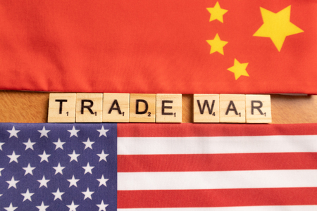 Maski, India 29,May 2019 : China-US trade war concept - flag of China and the United States with Scrabble wooden block lettes.のeditorial素材