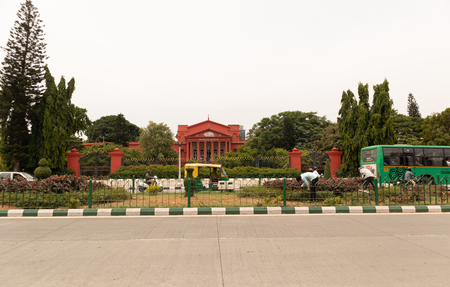 Bangalore India - June 3, 2019: Light moving traffic opposite to the High court of karnataka.のeditorial素材