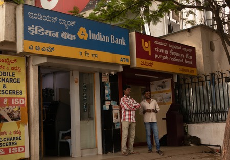 BANGALORE INDIA June 3, 2019 :People talking infront of the Indian bank ATM and Punjab national bank ATM at bangalore railway stationのeditorial素材