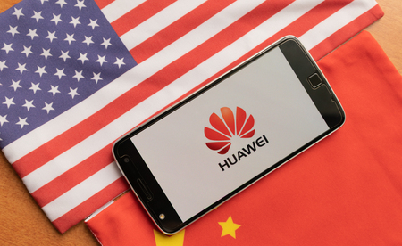 Bangalore, India, June 4, 2019 : Huawei Logo in Mobile, kept on the US and china flagのeditorial素材