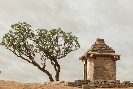 Small ruined Hanuman Temple at Hemakuta Hill top at Hampi,Karnatakaの写真素材