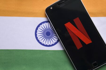 Maski, India - July 30, 2019: Netflix logo on Mobile with Indiain Flag as backgroundのeditorial素材