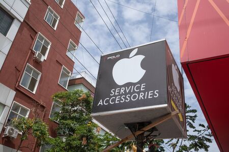 Bengaluru, India June 27,2019 : Front view Bill board or signage of Apple serive of Mobiles at...