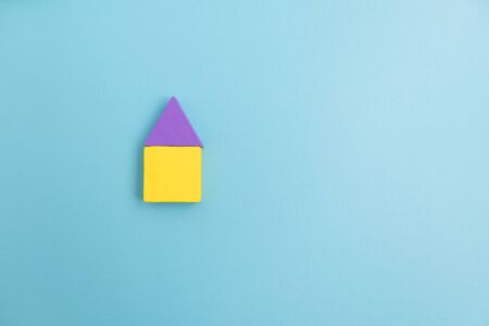 Colorful Wooden toy blocks on blue background.