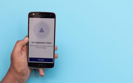 Maski, India 25, August 2019 : Hands using Registration failed UPI or Unified Payments Interface app...