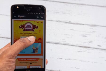 Maski, India - September 10, 2019 : customer checking Amazon great Indian festival sale coming soon...