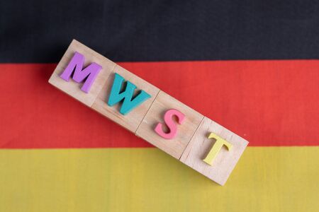 MWST or German Value Added Tax on german flagの写真素材