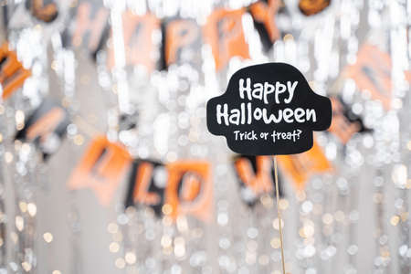 Happy Halloween and trick or treat signage booth prop on decorated background - concept of holiday and halloween festival.の写真素材
