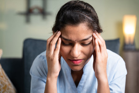 Head shot of young business girl suffering from headache - Concept of stress, work pressure and...