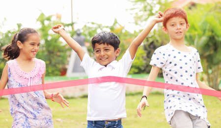 Young child won running case by reaching first - concept of competition, healthy and achieving goals...