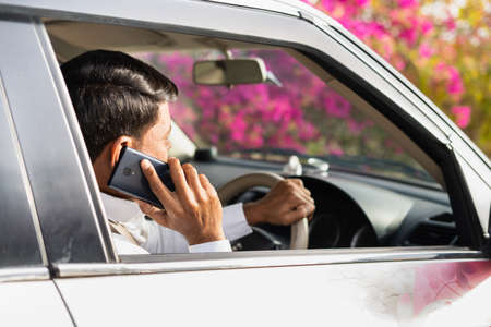 Cab driver from car asking customer adress on mobile phone call - concept of customer...