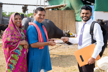 Milk dairy farm couple receiving money from banker at farmhouse - concet of financial, loan approval...