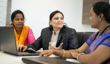 group of woman employees busy discussing during business meeting at office - concept of woman employment, empowerment, feminine and leadershipの写真素材