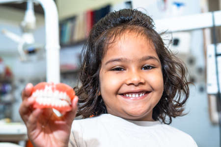 Happy smiling kid showing dentures by looking at camera - concept of childrens healthy oral or...