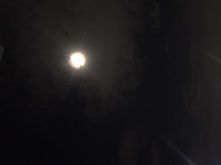 Moonlight in a dark room at night, closeup of photoの写真素材