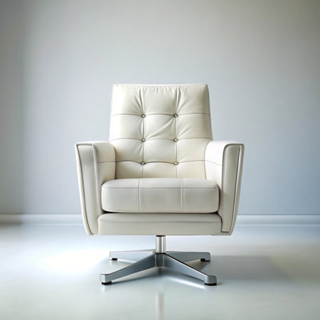 white leather armchair in a room with white walls and floor.の写真素材