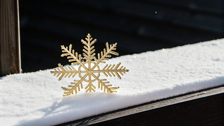 Snowflake on a wooden bench in the snow, Christmas background.の写真素材