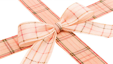 Pink ribbon with bow isolated on white background. Clipping path included.の写真素材