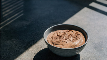Bowl of chocolate mousse on the street. Selective focus.の写真素材