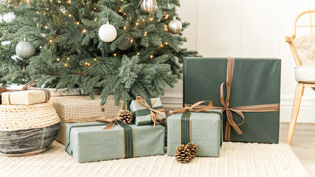 Christmas tree with presents and decorations in living room interior - Vintage Light Filterの写真素材