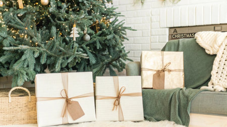 Christmas presents under the Christmas tree in the living room. Holiday conceptの写真素材