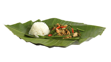 Thai food : stir fried pork and basil with rice on banana leafの写真素材