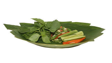 Thai vegetable salad on a green plate isolated on white background.の写真素材