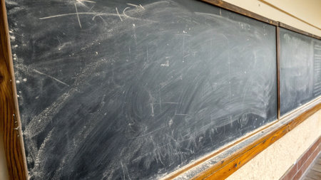 Empty blackboard in a school classroom. Back to school concept.