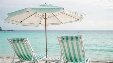 Umbrella and chair on the beach in summer for travel and vacationの写真素材