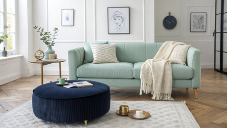 Modern living room interior design with blue sofa, coffee table, pillows, coffee table, books and...