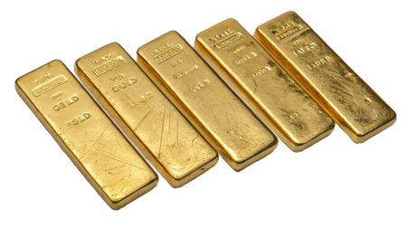 Gold bars isolated on white background, closeup of golden ingots