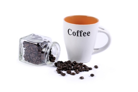 Coffee beans, mug and a glass container isolated on whiteの写真素材
