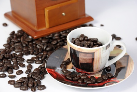 A cup of coffee with a coffee grinder の写真素材