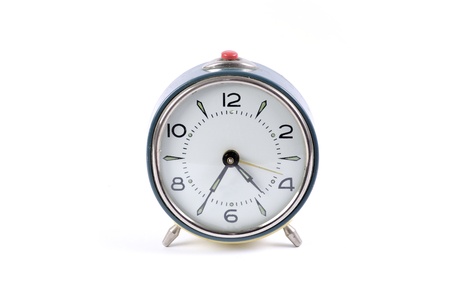 Old blue alarm clock on a white backgroundの写真素材