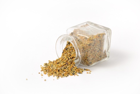 Honeybee pollen granules in glass jarの写真素材