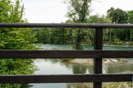 wooden handrail above riverの写真素材