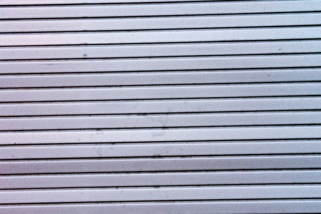 dirty shutter close up grey store frontの写真素材