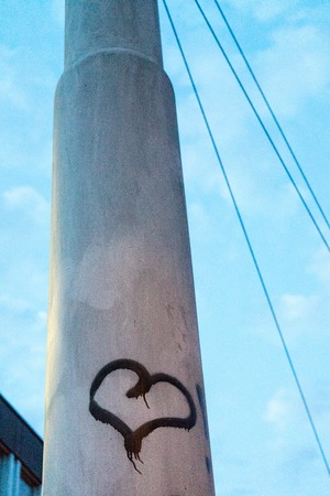 heart tag on light pole in the night