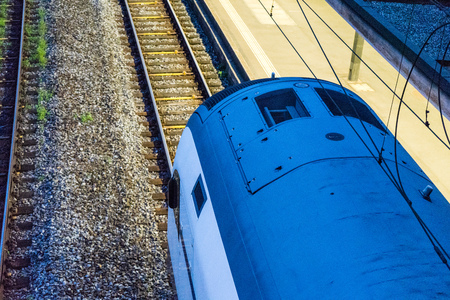 train at night in railway station seen from aboveの写真素材