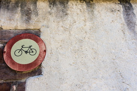vintage retro no bicycle sign on old historic wallの写真素材