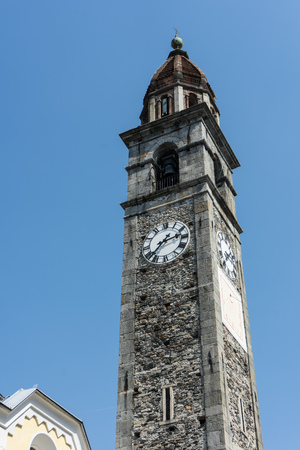Clock tower of Chiesa Parrocchiale dei Santi Pietro e Paolo at center square in Ascona, Locarno, Switzerlandの写真素材