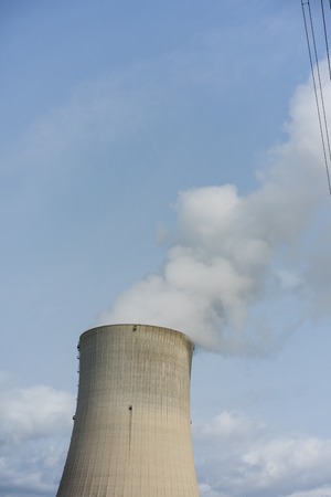 Cooling tower of nuclear power plant against the blue sky chimney landscape