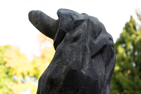 abstract close up view of stone sculpture in park in autumnの写真素材
