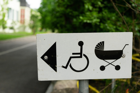 baby stroller and wheelchair sign directionの写真素材