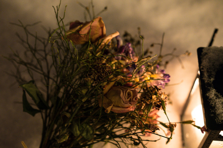 flower bouquet with lantern in snowの写真素材