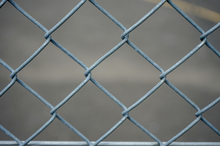 Grey iron fence, abstract close up view with concrete backgroundの写真素材