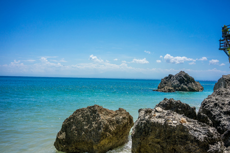 Big stone rock blue ocean and skyの写真素材
