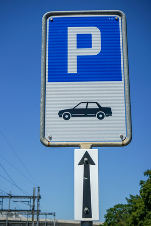 Blue car parking sign with illustration and white arrowの写真素材