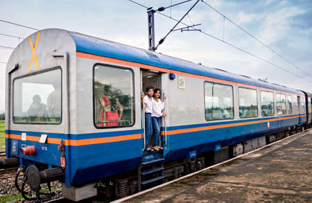 Young boy & girl enjoying the ride of vistadome train coach on way to scenic Araku valley.のeditorial素材